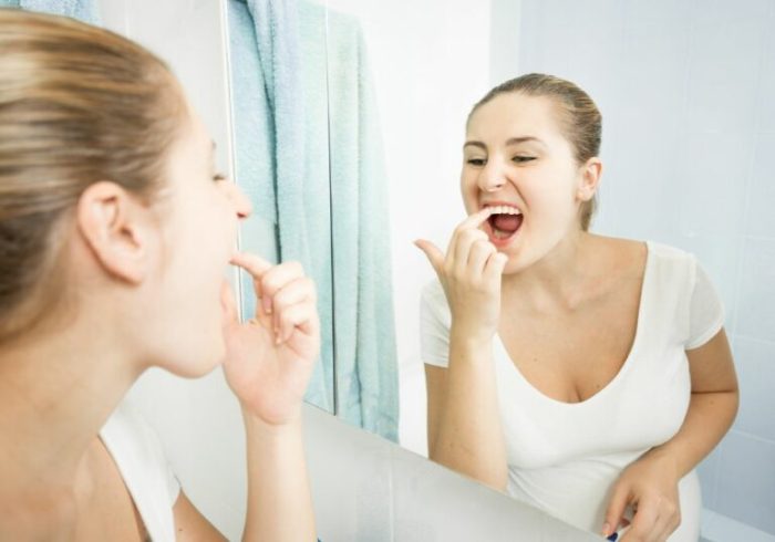 How to remove food stuck under gums